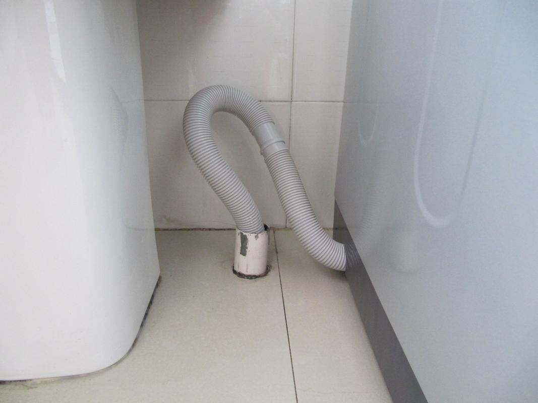 海尔洗衣机排水管怎么换（海尔洗衣机排水管怎么换位置）